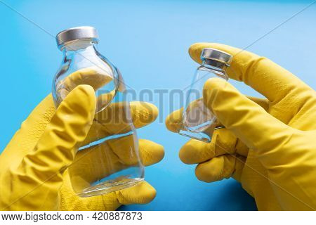 Medical Ampoule And Bottle In The Hands Of A Doctor