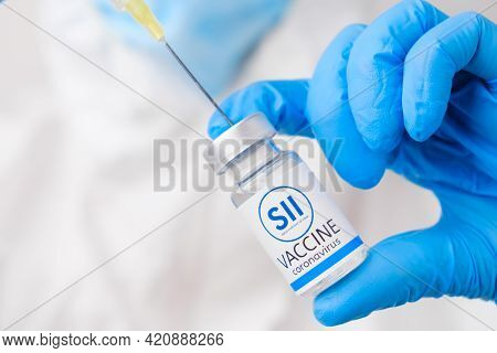 Sii Vaccine Against Coronavirus Collected Into The Syringe By Health Worker Or Doctor In Protective 