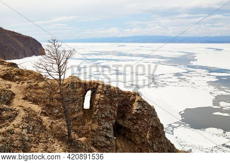 Cape Khoboy On The Island Of Olkhon. Lake Baikal In The Spring During The Melting Of Ice.