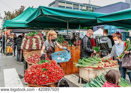 Prague, Czech Republic - May 15, 2021. Traditional Farmers Market In Quarter Of Dejvice. Seller And 