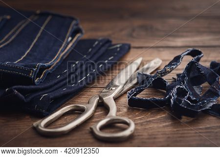 Shortening Jeans Pants. Jeans Cutting. Sewing Process.