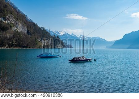 Two Boats Lying At The Shore Of Lake, Brienzersee, Switzerland
