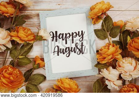 Happy August Typography Text With Flower Decoation On Wooden Background