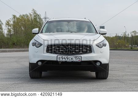 Novosibirsk, Russia - May 16, 2021: White  Infiniti Qx, Front View.  Photography Of A Modern Crossov
