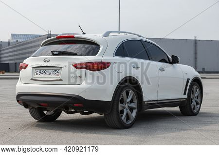 Novosibirsk, Russia - May 16, 2021: White  Infiniti Qx, Back View.  Photography Of A Modern Crossove