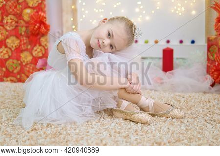 Little ballerina on scene. Children dance ?lassical ballet in studio. .