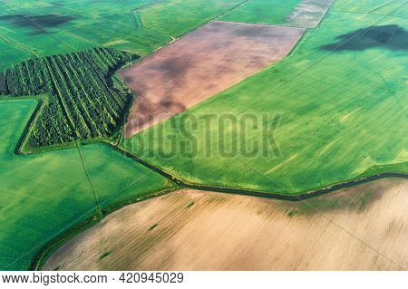 Aerial View Of Agricultural And Green Fields In Countruside. Nature Landscape In Summer Day