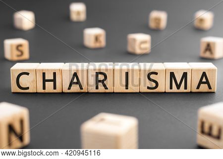 Charisma - Word From Wooden Blocks With Letters, Charisma Concept, Random Letters Around Black Backg