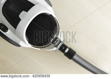 Bagless Cyclone Vacuum Cleaner On A Laminate. Electrical Apparatus That By Means Of Suction Collects