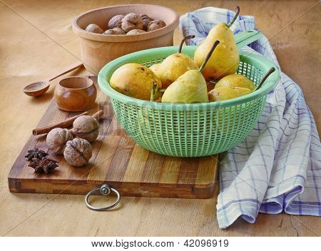 Pears,  Walnuts, Cinnamon And Ginger On A Wooden Table