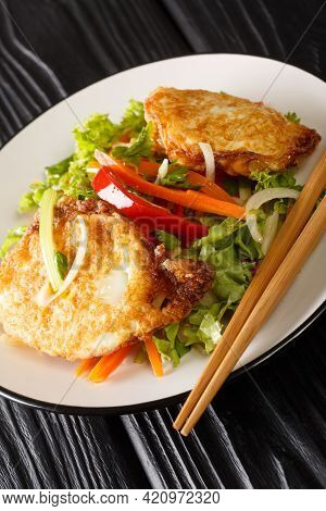 Yam Khai Dao Fried Egg Spicy Salad With Vegetables And Herbs Is A Thai Dish Close Up In The Plate On