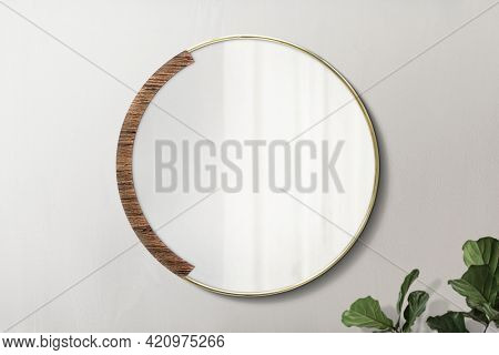 Circular mirror with a wooden backdrop with fiddle-leaf fig mockup