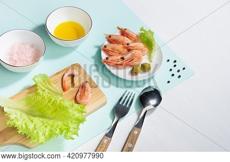 Cooking Of Spring Salad With Shrimps, Green Olive, Greens, Olive Oil, Ingredients On Pastel Minty Ba