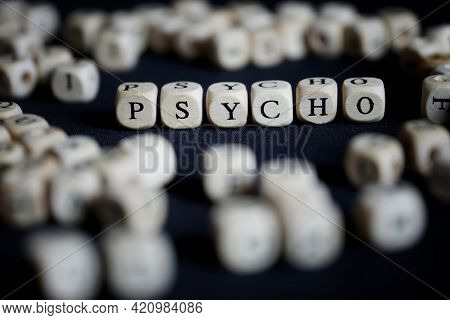 The Word Psycho Made Up Of Many Letter Cubes On A Dark Surface. Psychology, Psychoanalysis, Psychoth