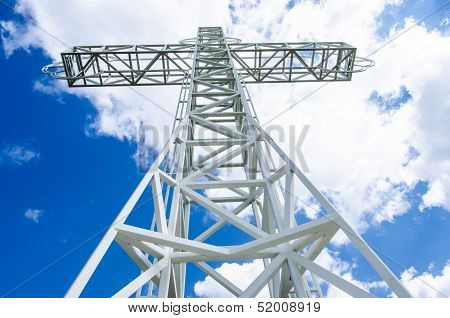 White steel tower cross, up view.