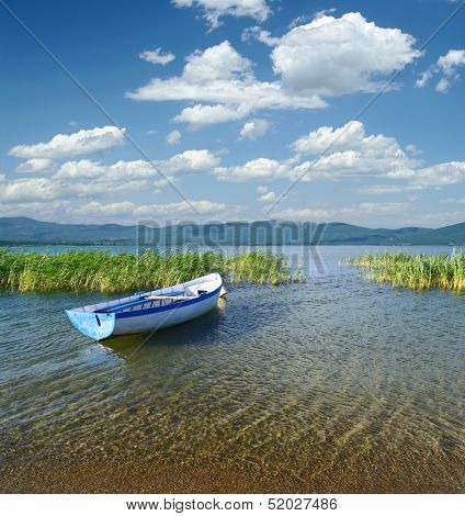 cloudscape on a rowboat moored in Prespa Lake, Republic of Macedonia