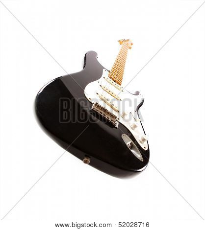 Vintage black electric body guitar, isolated on white.  