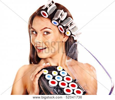 Woman holding hair curlers for head. Isolated.