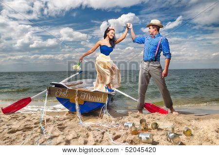 Romantic young couple cuddling in rowboat at lake
