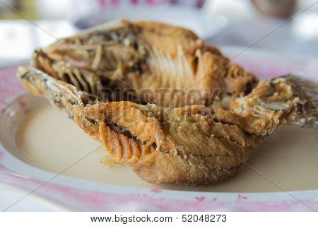 Fried snapper with fishsauce on the plate