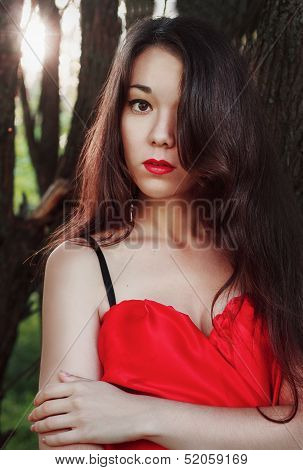 Portrait of beautiful girl in red dress