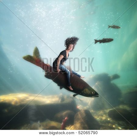 a pretty girl riding a fish