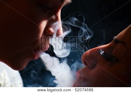 beautiful girls in smoke with hookah