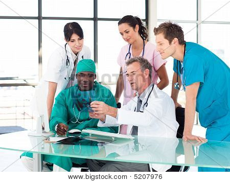 Medical Team Studying An X-ray