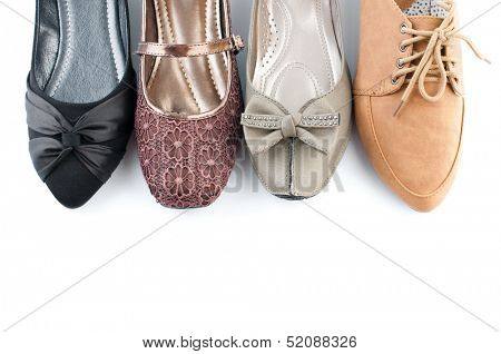 Various female flat shoes isolated over white