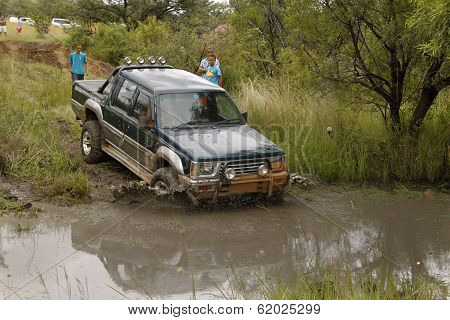 Viridian Green Mitsubishi Colt Rodeo Twin Cab Crossing Muddy Pond