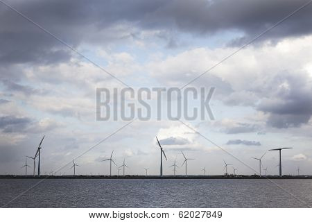 Wind Turbines And Cloudy Sky
