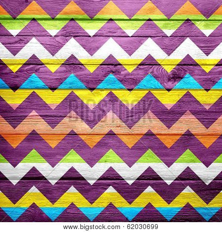Colorful chevron pattern on wood texture