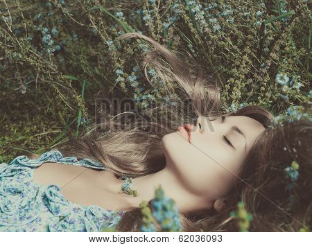 Beautiful Lady Lying Amond Flowers