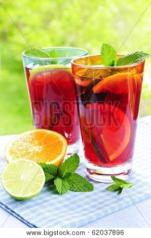 Refreshing fruit punch in two glasses outside