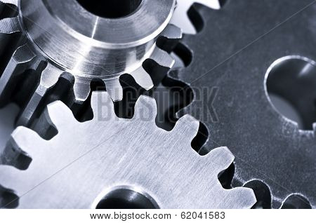 Industrial metal gears and machine parts connected