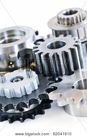 Interlocking industrial metal gears isolated on white