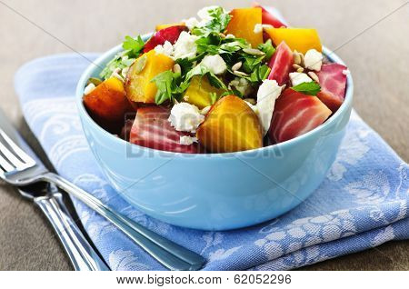 Bowl of roasted sliced red and golden beets