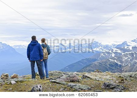 Hikers enjoying scenic Canadian Rocky Mountains view in Jasper National Park