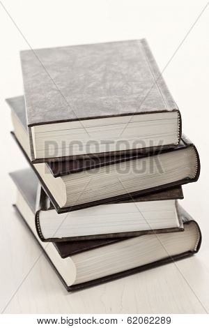 Stack of old hard cover leather bound books