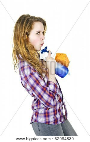 Playful young woman having fun with cleaning supplies isolated on white