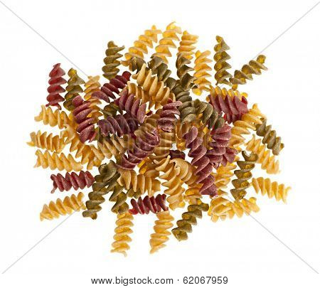 Uncooked multicolored kamut pasta isolated on white background