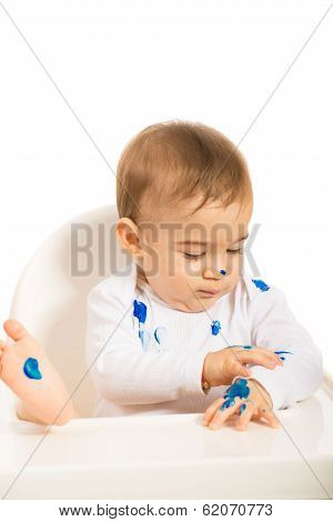 Baby Boy With Blue Paint On Hands