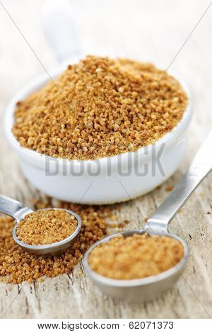 Organic coconut palm sugar in measuring spoons