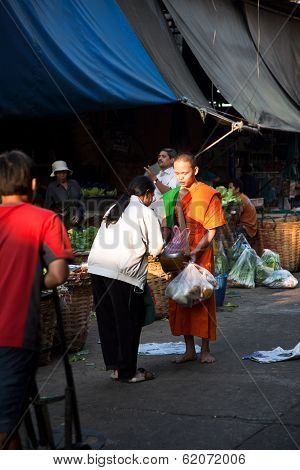 People Donate Food To The Monk