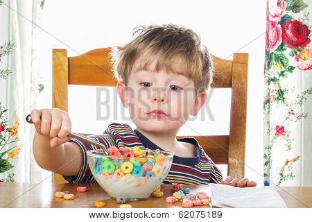 Young boy eating breakfast cereal