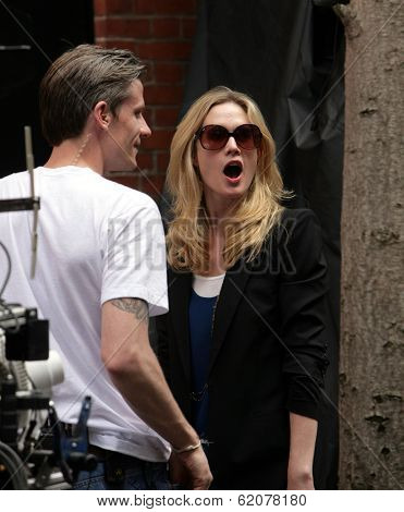 NEW YORK CITY - APRIL 15: Former SVU star Stephanie March (R) admires a tattoo on the arm of a crew member on the set of 