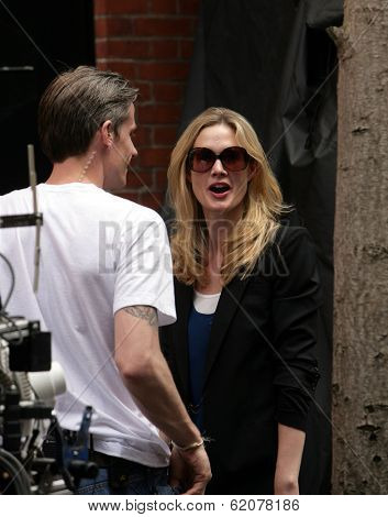 NEW YORK CITY - APRIL 15: Former SVU star Stephanie March (R) admires a tattoo on the arm of a crew member on the set of 