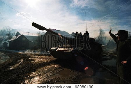 MODRICA, BOSNIA - JAN 8: A Bosnian Serb T-54 tank passes through Modrica, Bosnia, on Friday, January 8, 1995. The tank is part of a larger movement of troops and armor in the region.