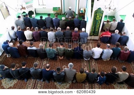 NOVI PAZAR, SERBIA - APRIL 28: Muslim men pray in the southern Serbian city of Novi Pazar, near the borders of Montenegro, Kosovo and Bosnia, worship at a local mosque on April 28, 2002 in Novi Pazar, Serbia.