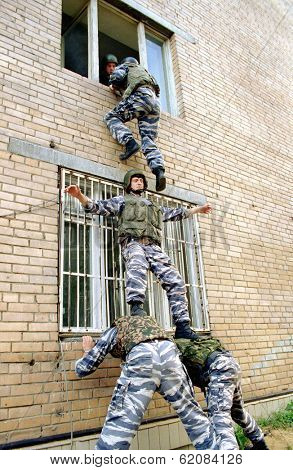 MOSCOW - AUGUST 6:  Russia's elite OMON special police force practice an assault at a training ground in Moscow, Russia, on Sunday,  August 6, 2000.